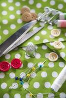 a pile of buttons on a white table photo