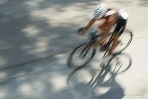 a man riding a bike photo