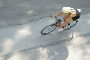 a man riding a bike photo