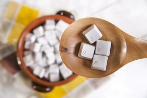 a wooden spoon with a keyboard on it photo