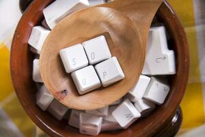 a wooden spoon with white cubes on it photo