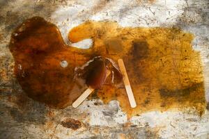 a brown liquid on a surface photo