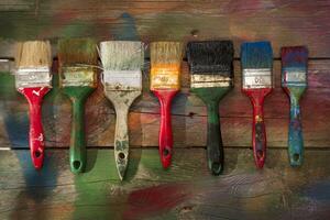 a table with paint cans and brushes photo