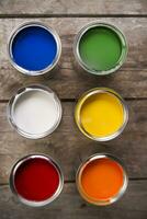 a group of paint cans with different colors photo