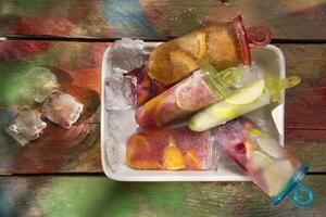 a bowl filled with ice cream and fruit photo