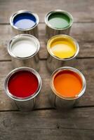 a group of paint cans with different colors photo