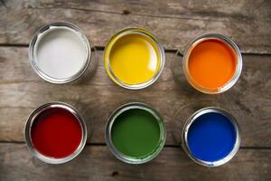 a group of paint cans with different colors photo