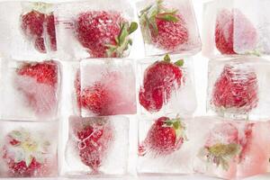 Ice cubes with strawberries photo