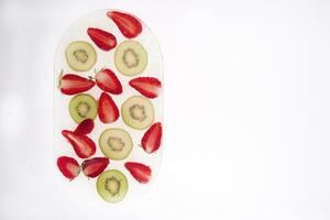 Kiwi and strawberries photo