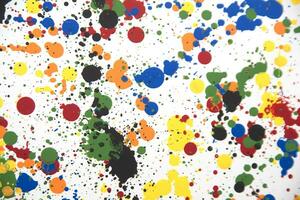 a colorful paint splattered surface with many different colors photo