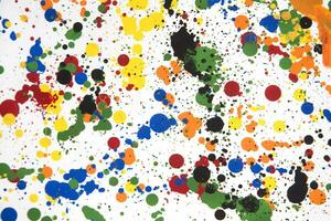 a colorful paint splattered surface with many different colors photo