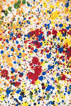 a colorful paint splattered surface with many different colors photo