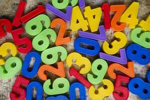 colorful plastic numbers on a white background photo