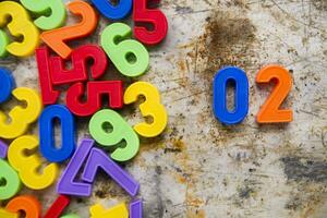 colorful plastic numbers on a white background photo