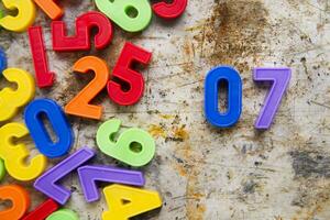 colorful plastic numbers on a white background photo