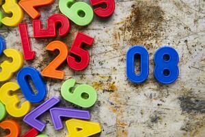 colorful plastic numbers on a white background photo