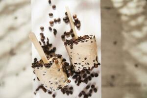 coffee ice cream pops on a wooden board photo