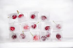 ice cubes with cherries on top photo
