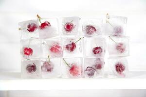 ice cubes with cherries on top photo