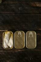 a row of gold coins on a wooden table photo