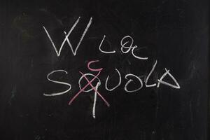 back to school written on blackboard with chalk photo