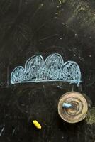 a chalk drawing of a cloud and snow on a blackboard photo