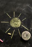 a chalk drawing of a cloud and snow on a blackboard photo