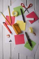 a table with a bunch of different colored paper photo