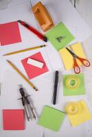 a table with a bunch of different colored paper photo