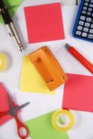 a table with a bunch of different colored paper photo