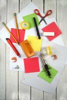 a table with a bunch of different colored paper photo