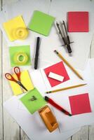 a table with a bunch of different colored paper photo