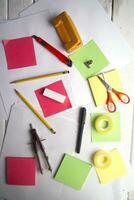 a table with a bunch of different colored paper photo