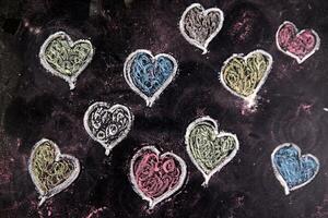 a chalkboard with hearts drawn on it photo