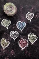 a chalkboard with hearts drawn on it photo