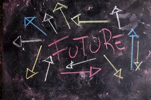 future written on a blackboard with arrows pointing in different directions photo