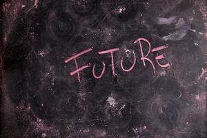 future written on a blackboard with arrows pointing in different directions photo