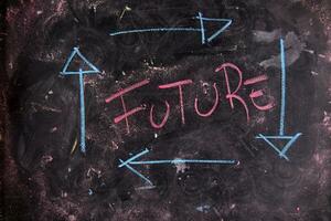 future written on a blackboard with arrows pointing in different directions photo