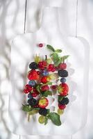 Skewer of berries photo