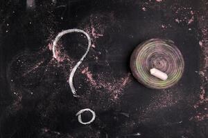 a question mark is drawn on a blackboard photo