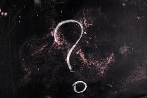 a question mark is drawn on a blackboard photo