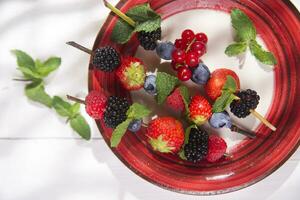 Skewer of berries in pot photo