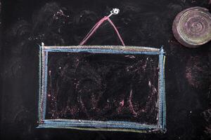 a chalk drawing of a square frame with a triangle on it photo