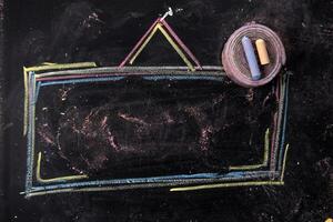 a chalk drawing of a square frame with a triangle on it photo