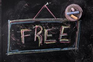 a chalkboard with the word free written on it photo