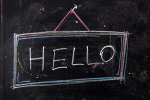 hello written on a blackboard with chalk photo