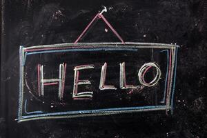 hello written on a blackboard photo