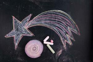 a chalk drawing of a star on a blackboard photo