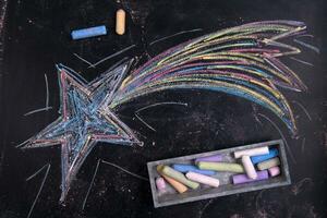 a chalk drawing of a star on a blackboard photo