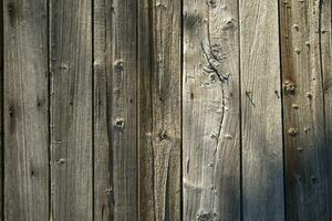 a close up of a wooden wall with a clock on it photo